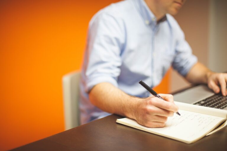 Man completing immigration forms immigrate to Canada