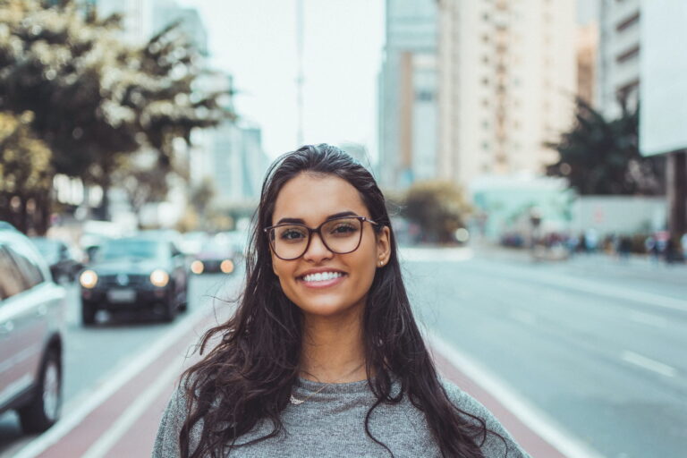Woman smiling in downtown Canada after immigrating