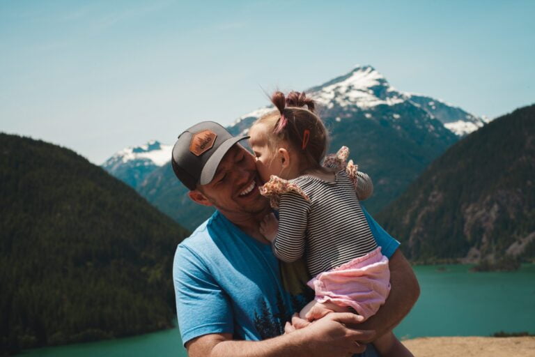 Man and daughter family immigrated to Canada beautiful mountains and lake